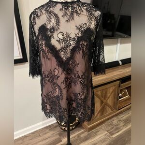 Size M black lace blouse with nude lining to make the design